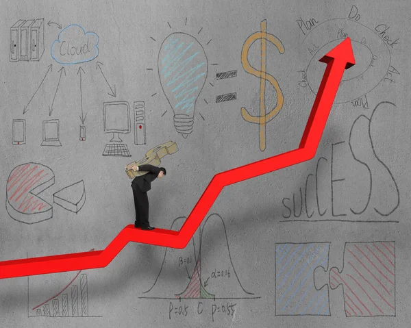 Businessman on growing red arrow with business doodles — Stock Photo, Image