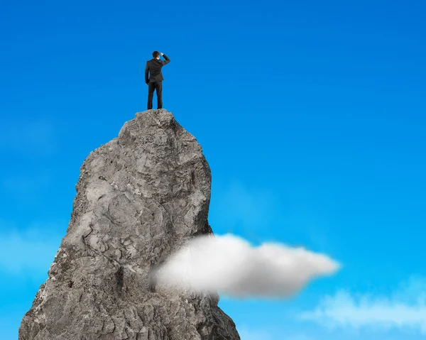 Gazing on top of rock mountain in the sky — Stock Photo, Image