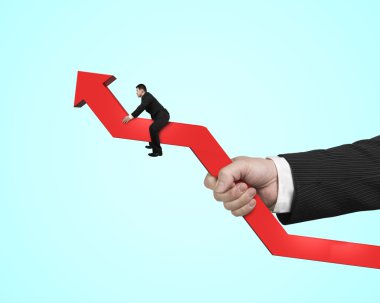 başka bir el holding ile kırmızı ok üzerinde oturan adam