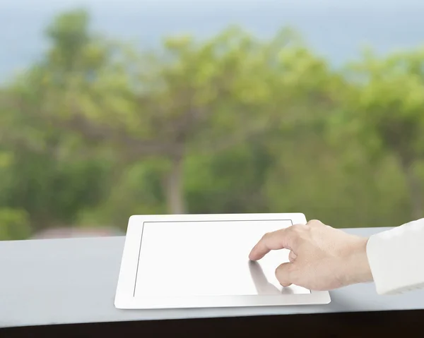 Touching tablet with blank screen — Stock Photo, Image