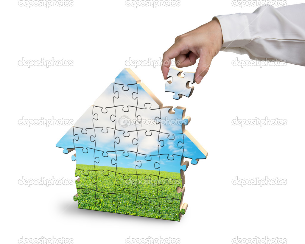 Assembling house shape puzzles in beautiful landscape 