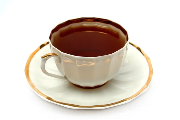 Filiżankę czarnej herbaty na talerzu — Zdjęcie stockowe