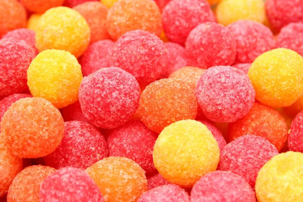 Horizontální pozadí z pestrobarevných sladkostí — Stock fotografie