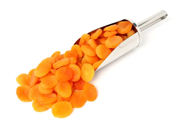 Dried apricots and metal scoop — Stock Photo, Image