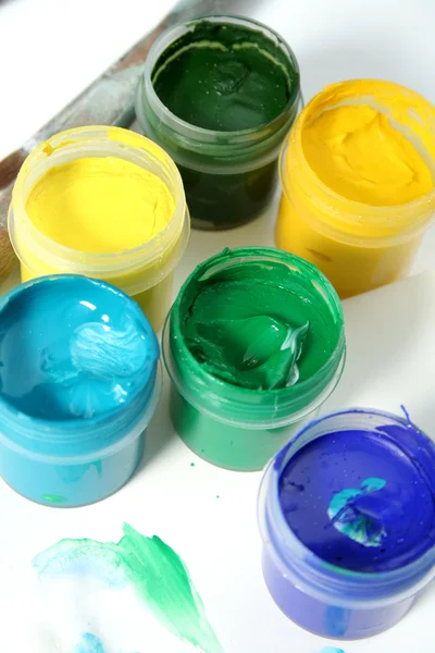 Jars with multi-coloured gouache — Stock Photo, Image