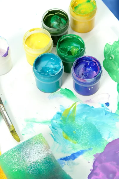 Tools of the artist: paints, brush and a paper — Stock Photo, Image