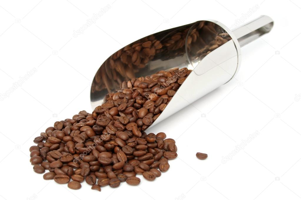 The fried grains of coffee and metal scoop