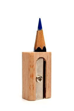 pencil inside of a sharpener for pencils which stands vertically