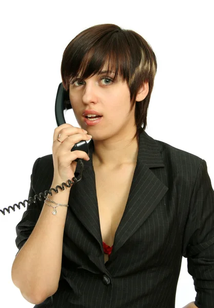 The young nice girl speaks by phone — Stock Photo, Image