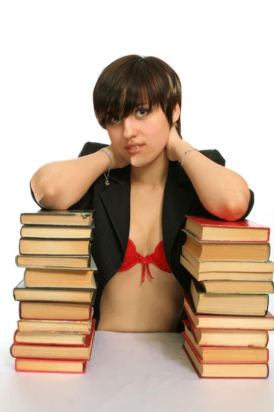 Молодая улыбающаяся девушка с книгами — стоковое фото