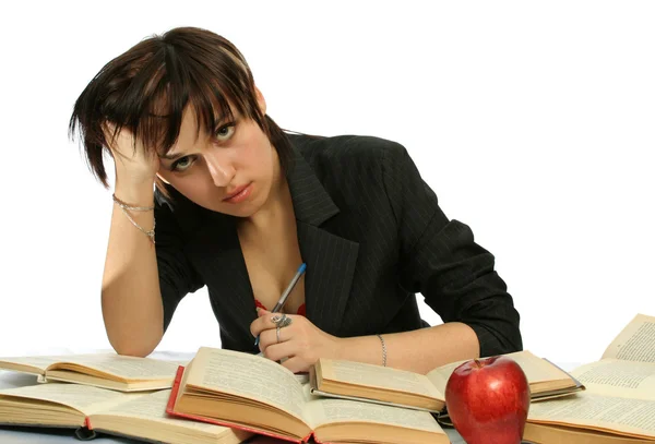 The young girl with books and a red apple — Stock Photo, Image