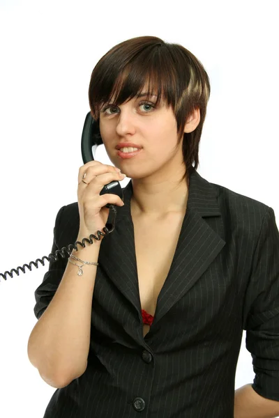 The young nice girl speaks by phone with a smile — Stock Photo, Image