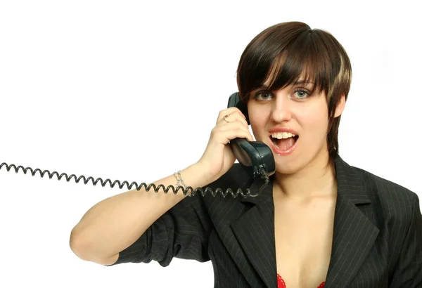 The young nice girl speaks by phone with a smile — Stock Photo, Image