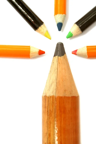 The big pencil and five small color pencils on a vertical — Stock Photo, Image