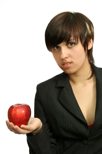 Friendly businesswoman with red apple Stock Picture