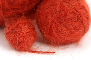Balls of knitting red yarn clipart