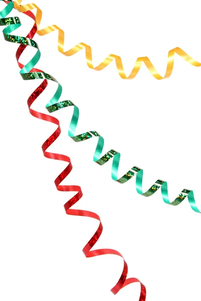 El oropel de Año Nuevo del color rojo, verde y amarillo sobre el blanco —  Fotos de Stock