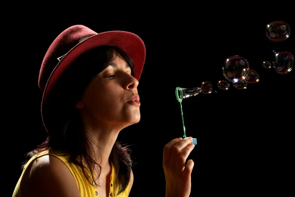 Young brunette girl and bubbles — Stock Photo, Image