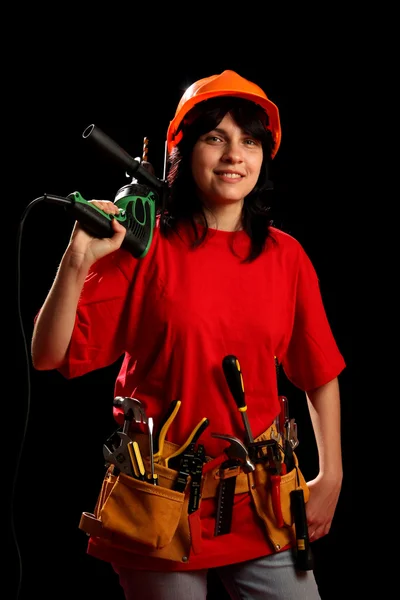 Young woman with work tools and drill — Stock Photo, Image