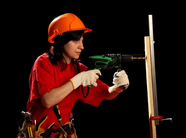 Young woman with work tools and drill — Stock Photo, Image