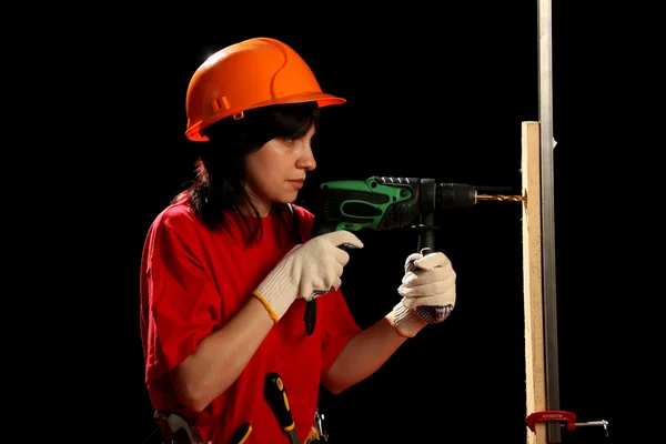 Young woman with work tools and drill — Stock Photo, Image