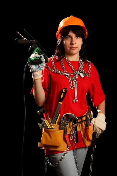 Jeune femme avec outils de travail et perceuse — Photo