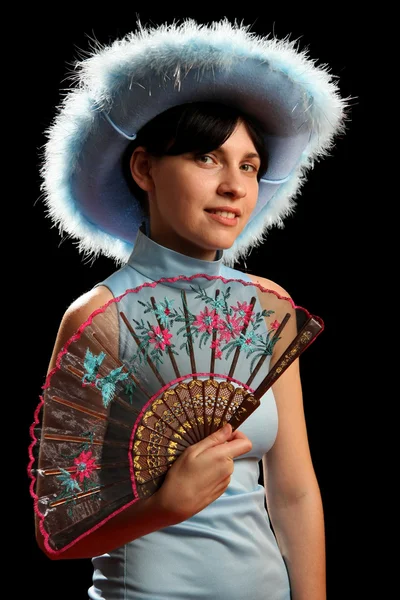Brunette girl with cowboy hat and spanish fan — Stock Photo, Image