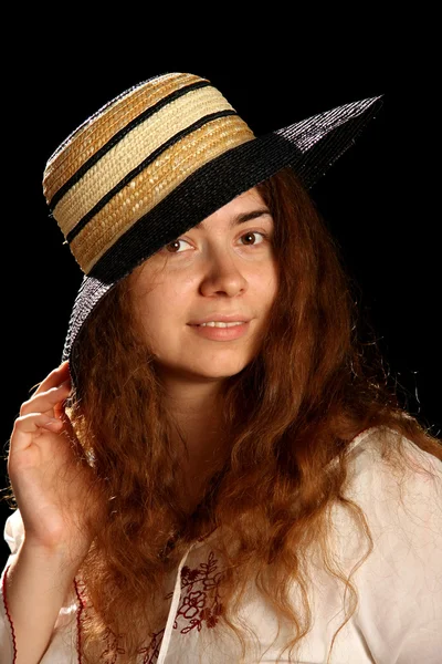 Young brunette girl and straw hat — Stock Photo, Image