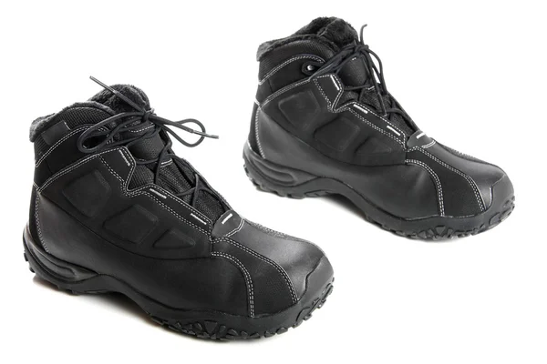 Dos botas de invierno negras para hombre en blanco —  Fotos de Stock