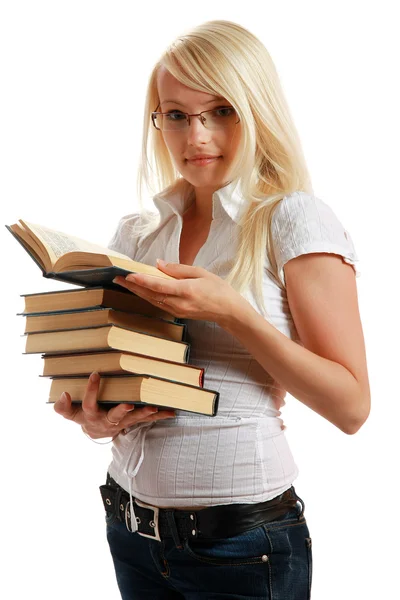 Young girl leaned over pile of books — Stock Photo, Image