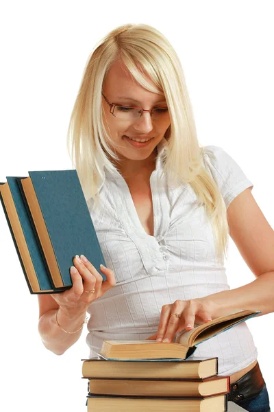 Young girl leaned over pile of books — Stock Photo, Image