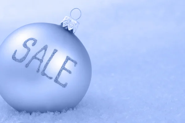 Christmas ornament on a snow — Stock Photo, Image