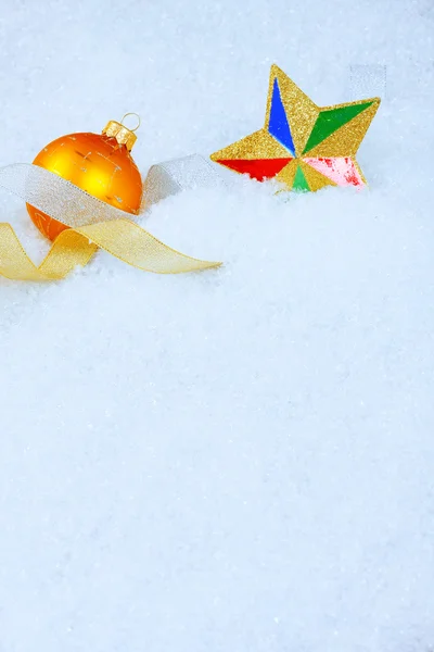 Christmas ornaments on a snow Stock Picture