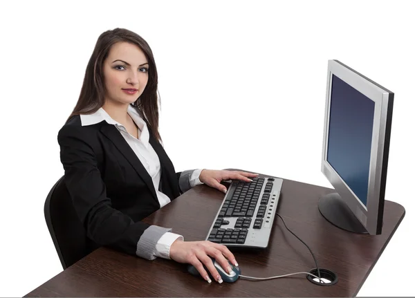 Jovem mulher trabalhando em um computador — Fotografia de Stock