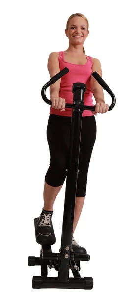 Bionda donna esercizio su un stepper — Foto Stock