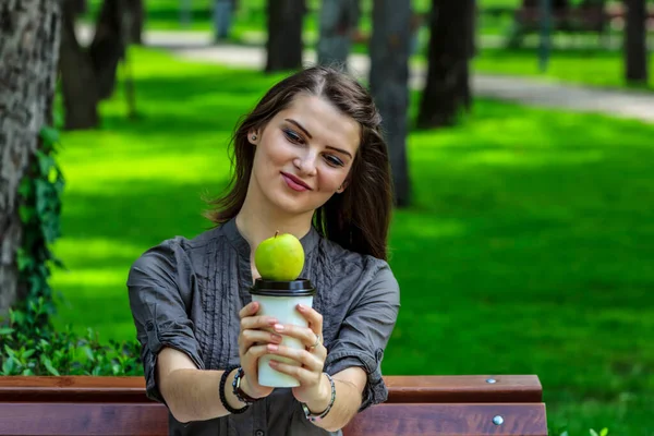 Young Woman Studying Park Holds Green Apple Cup Coffee Looking — Fotografia de Stock