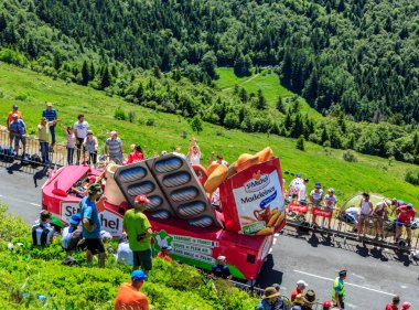 Pas de Peyrol, France - July 6,2016: St. Michel MadeleinesCaravan during the passing of the Publicity Caravan on the road to Pas de Pyerol (Puy Mary) in Cantal,in the Central Massif, during the stage 5 of Tour de France on July 6, 2016. 