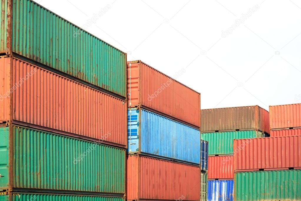 Stack of Cargo Containers awaiting transportation on white back