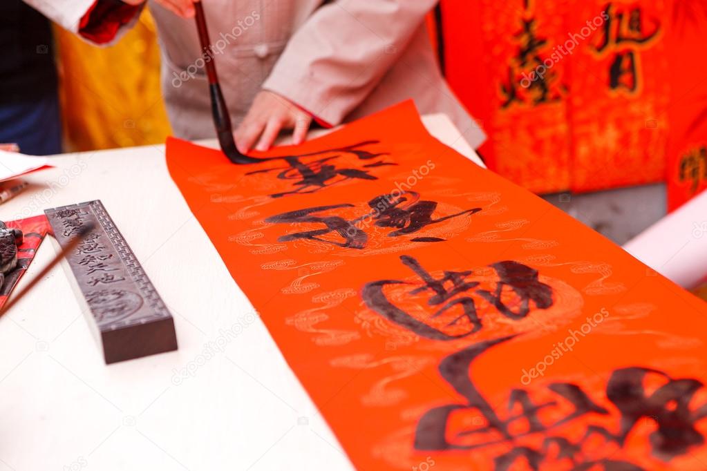The man writing Chinese spring festival couplets