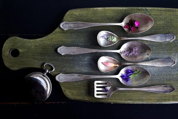 Old spoons with flowers Royalty Free Stock Images