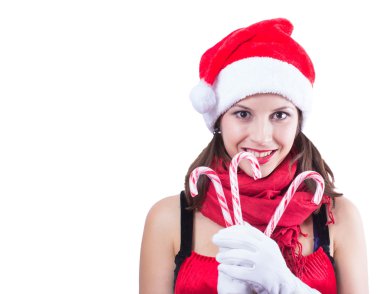 şeker ile beyaz arka plan üzerinde Noel Baba giysili güzel kadın