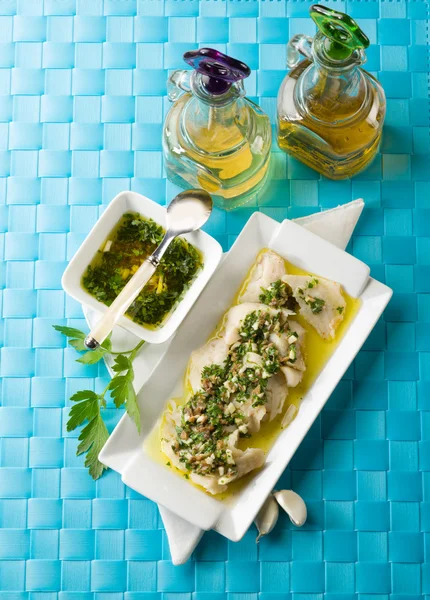 Cod fillet marinated with parsley anchovy and garlic — Stock Photo, Image
