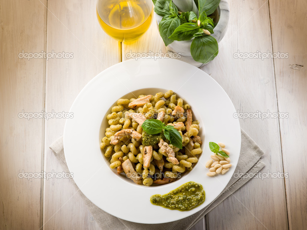 pasta with pesto sauce and chicken breast, healthy food
