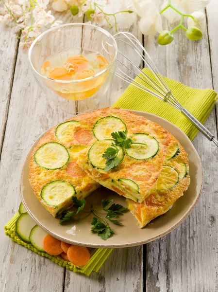 Omelette with carrot zucchinis and parsley — Stock Photo, Image