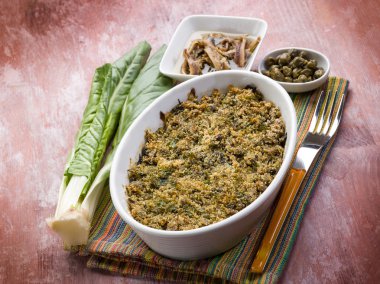 gratin of swiss chard anchovies and capers clipart