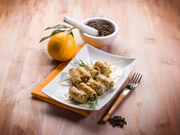 Skewer rolled up with clove and orange juice — Stock Photo, Image