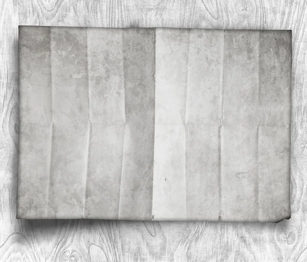 Feuille de papier blanc sur table en bois noir — Photo