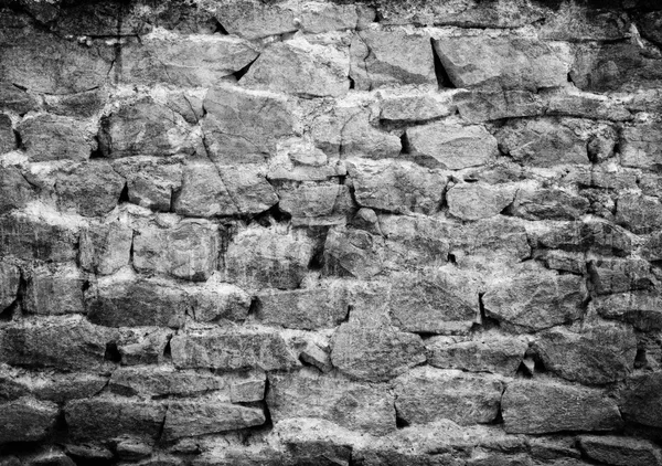 Zwarte stenen muur — Stockfoto