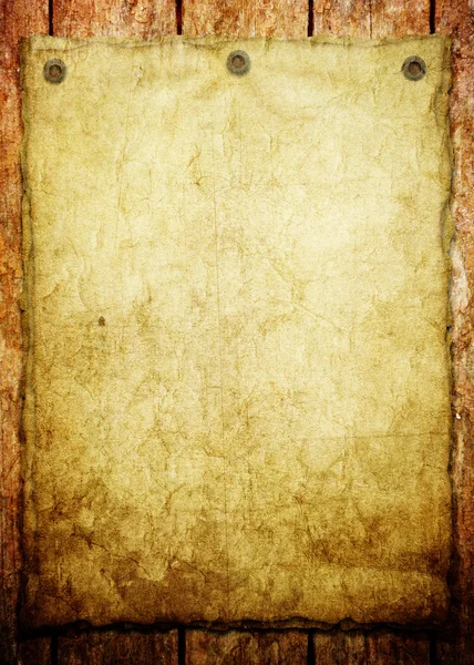 Old paper on wood background — Stock Photo, Image