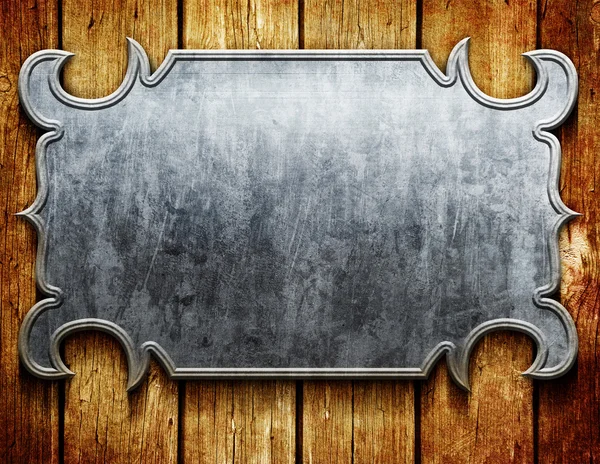 Placa de metal vintage em tábuas de madeira velhas — Fotografia de Stock